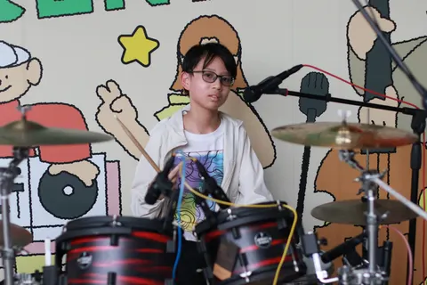 Playing drums with the band